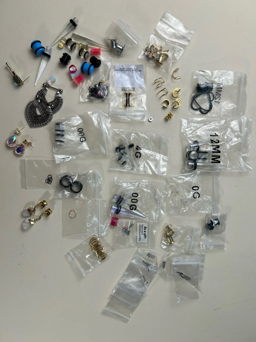Jewelry: Earrings in various designs and sizes, and piercings.